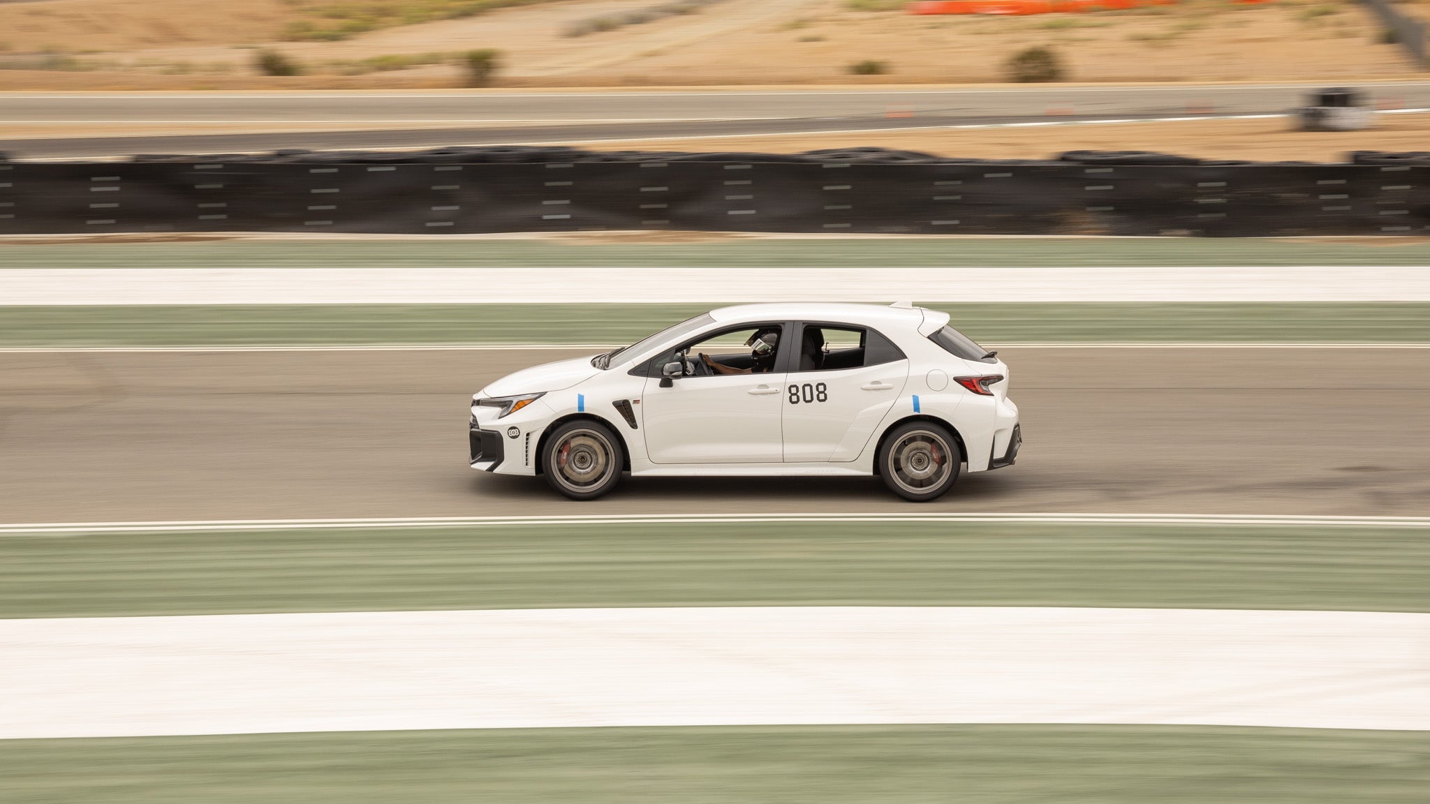 Toyota GR Corolla driving on the track while testing performance parts.